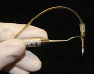 FIGURE 3. The dental endoscope is equipped with a 0.9-mm flexible, fiber-optic cord with an externally mounted camera.