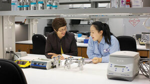 Pictured from left to right: Nicola Partridge, PhD,  in her lab with  Xin Li, associate professor of Basic Science and Craniofacial Biology Photo courtesy of   NYU Dentistry 