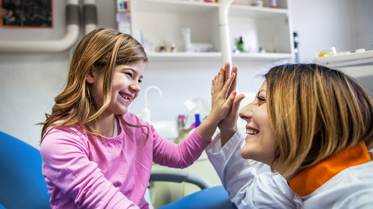 Dental professional with child