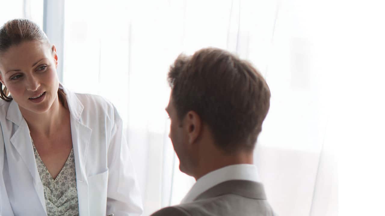 People talking in a dental practice