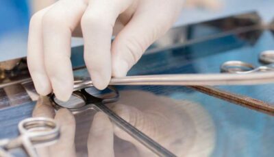 doctor picking up dental tool