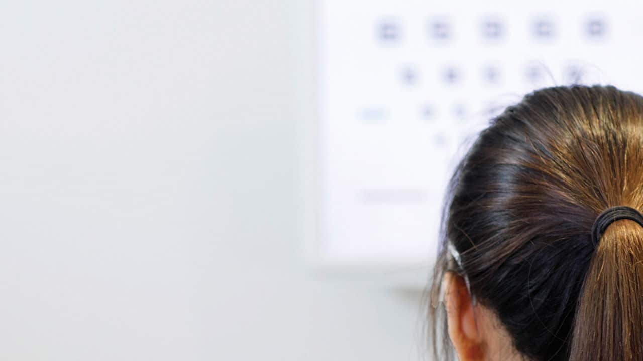 Woman taking an eye test
