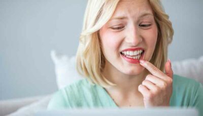 woman touching her lip