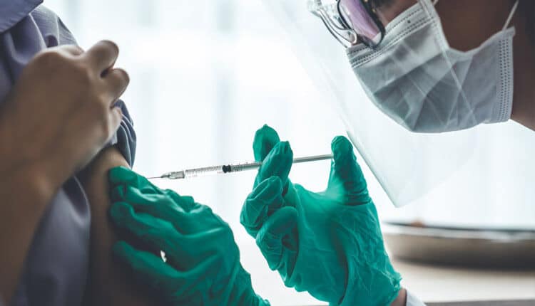 doctor administering vaccine