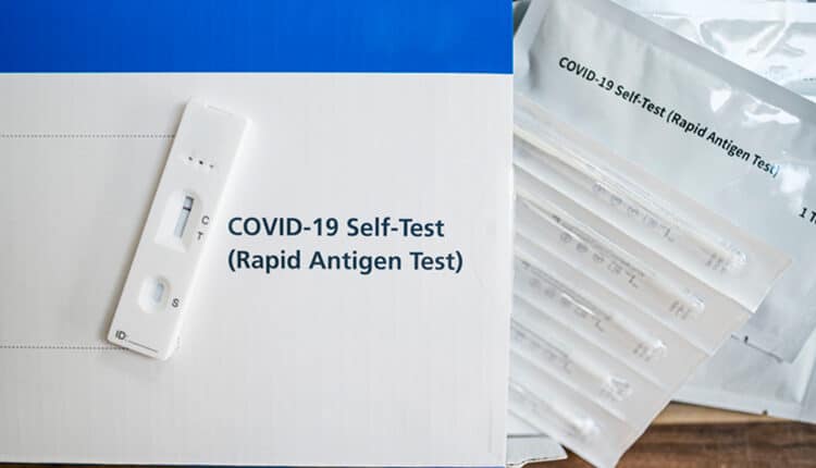 A close up of a lateral flow home testing kit