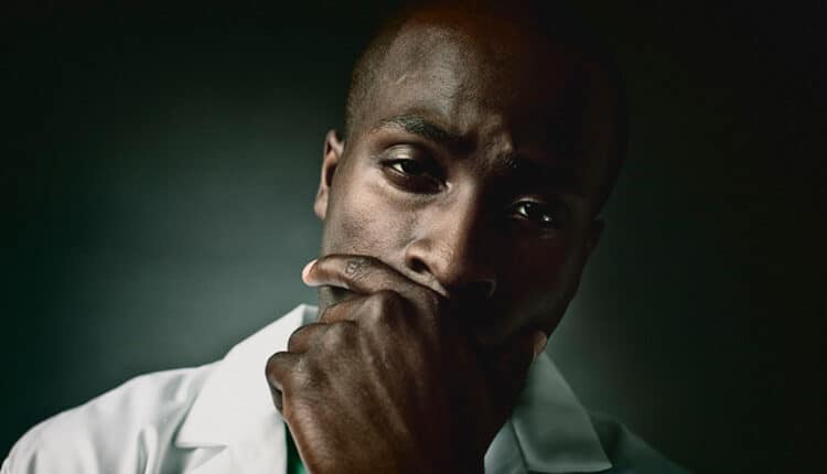face of a weary doctor