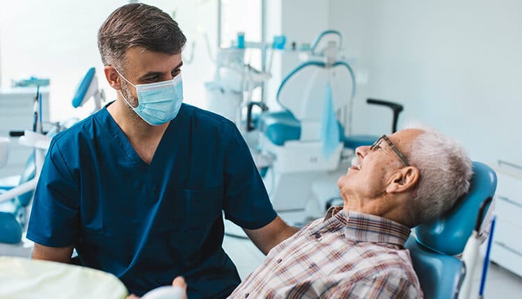 Senior patient sitting in his dentists chair before starting his checkup