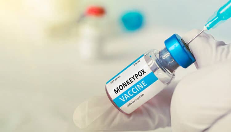 Vaccination for booster shot for Smallpox and Monkeypox MPXV . Doctor with vial of roses vaccine for Monkeypox disease